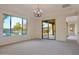 Bright, airy living room with large windows offering views of the water feature at 3750 E Sawtooth Dr, Chandler, AZ 85249