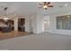 Open layout with a kitchen featuring granite counters and dark wood cabinets at 3750 E Sawtooth Dr, Chandler, AZ 85249