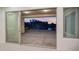 Exterior view from a large sliding glass door overlooking the patio and lake at 3750 E Sawtooth Dr, Chandler, AZ 85249