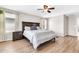 Serene bedroom offering wood-look floors, ceiling fan, and a neutral palette for a peaceful and relaxing atmosphere at 3841 E Jasper Dr, Gilbert, AZ 85296