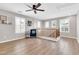 Inviting loft area with natural light, wood-look floors, shutters, and cozy seating perfect for relaxation at 3841 E Jasper Dr, Gilbert, AZ 85296