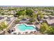 Aerial view of a community pool, playground and BBQ area nestled in a charming neighborhood at 3841 E Jasper Dr, Gilbert, AZ 85296
