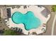 Overhead view of a sparkling community pool, with plenty of seating, surrounded by lush landscaping at 3841 E Jasper Dr, Gilbert, AZ 85296