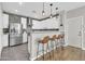 Bright kitchen featuring stainless steel appliances, white cabinets, and tiled backsplash at 3841 E Jasper Dr, Gilbert, AZ 85296