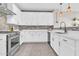 Bright kitchen featuring stainless steel appliances, white cabinets, and tiled backsplash at 3841 E Jasper Dr, Gilbert, AZ 85296