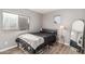 Cozy bedroom with neutral decor and a window providing natural light at 4128 E Coolbrook Ave, Phoenix, AZ 85032