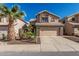 Charming two-story home featuring a desert landscape, two car garage and a terracotta tile roof at 4128 E Coolbrook Ave, Phoenix, AZ 85032
