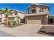 Charming two-story home featuring a desert landscape, two car garage and a terracotta tile roof at 4128 E Coolbrook Ave, Phoenix, AZ 85032