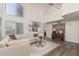 Bright living room with vaulted ceilings, neutral color palette, hardwood floors, and modern furniture at 4128 E Coolbrook Ave, Phoenix, AZ 85032