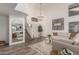Bright living room with vaulted ceilings, neutral color palette, hardwood floors, and a staircase at 4128 E Coolbrook Ave, Phoenix, AZ 85032