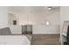 Open loft space with wood floors, neutral walls, and a decorative security gate at 4128 E Coolbrook Ave, Phoenix, AZ 85032
