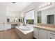 Elegant bathroom with a soaking tub, double sinks, and large window at 41817 N Bridlewood Way, Phoenix, AZ 85086