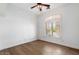 Neutral bedroom with hardwood flooring, plantation shutters, and a ceiling fan at 41817 N Bridlewood Way, Phoenix, AZ 85086
