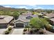 Exterior front view of home highlighting mature landscaping and desert surroundings at 41817 N Bridlewood Way, Phoenix, AZ 85086