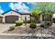 Charming single-story home featuring desert landscaping and a neutral color palette at 41817 N Bridlewood Way, Phoenix, AZ 85086