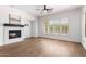 Comfortable living area with a fireplace, hardwood floors, and bright natural light at 41817 N Bridlewood Way, Phoenix, AZ 85086