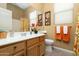 Bright and functional bathroom featuring a wooden vanity, floral-themed decor, and ample natural light at 4632 S Alamos Way, Gold Canyon, AZ 85118