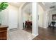 Inviting entryway featuring tile flooring, arched doorways and views of the dining room and office area at 4632 S Alamos Way, Gold Canyon, AZ 85118