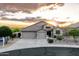 Charming home features a three-car garage, desert landscaping and sunset views at 4632 S Alamos Way, Gold Canyon, AZ 85118