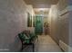 Inviting entryway features a bench with accent pillows and a lovely teal door at 4632 S Alamos Way, Gold Canyon, AZ 85118