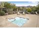 Community hot tub with a nearby lounge area and views of the mountain landscape at 4632 S Alamos Way, Gold Canyon, AZ 85118