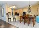 Open kitchen with breakfast bar seating and dining area, ideal for Gathering meals and social gatherings at 4632 S Alamos Way, Gold Canyon, AZ 85118