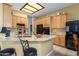 Kitchen featuring granite countertops, ample storage, stainless steel appliances, and a breakfast bar at 4632 S Alamos Way, Gold Canyon, AZ 85118