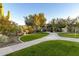 Manicured landscaping and walkway leading through the community, creating a serene outdoor environment at 4632 S Alamos Way, Gold Canyon, AZ 85118