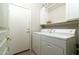 Practical laundry room featuring a washer, dryer, shelving, and cabinets for efficient organization at 4632 S Alamos Way, Gold Canyon, AZ 85118