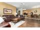 Open-concept living room flows into the kitchen, featuring hardwood floors and ample seating at 4632 S Alamos Way, Gold Canyon, AZ 85118