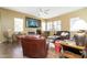 Comfortable living room with fireplace and ample seating, ideal for relaxing and enjoying entertainment at 4632 S Alamos Way, Gold Canyon, AZ 85118