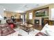 Inviting living room boasts a fireplace, hardwood floors, and comfortable seating for relaxing and entertaining at 4632 S Alamos Way, Gold Canyon, AZ 85118