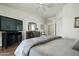 Spacious main bedroom with wood floors, dresser, and ensuite bathroom access at 4632 S Alamos Way, Gold Canyon, AZ 85118