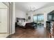 Spacious main bedroom features hardwood floors, a ceiling fan, and access to an outdoor patio at 4632 S Alamos Way, Gold Canyon, AZ 85118