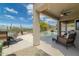 Relaxing covered patio with outdoor furniture overlooking a pool and desert landscape at 4632 S Alamos Way, Gold Canyon, AZ 85118