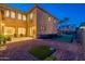 Expansive backyard featuring a putting green and a cozy patio, perfect for outdoor entertaining and relaxation at 4894 E Palm Beach Dr, Chandler, AZ 85249