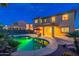Stunning backyard with a sparkling pool reflecting the home's architecture, creating an oasis for outdoor enjoyment at 4894 E Palm Beach Dr, Chandler, AZ 85249