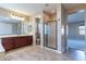 Bathroom featuring tile floors, vanity with sink, glass-enclosed shower, and open layout at 4894 E Palm Beach Dr, Chandler, AZ 85249