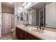 Bathroom featuring dual sinks, vanity and mirror with decorative shower curtain at 4894 E Palm Beach Dr, Chandler, AZ 85249