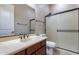 Bathroom featuring tile floors, vanity with sink, glass-enclosed shower at 4894 E Palm Beach Dr, Chandler, AZ 85249