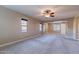 Large bedroom with soft carpeting, a ceiling fan, and lots of windows for natural light and views at 4894 E Palm Beach Dr, Chandler, AZ 85249