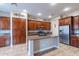Modern kitchen showcasing custom wood cabinets, stainless steel appliances, and an island at 4894 E Palm Beach Dr, Chandler, AZ 85249