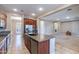 Open-concept kitchen with an island, stainless steel appliances, and views of the living room at 4894 E Palm Beach Dr, Chandler, AZ 85249