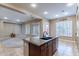Stylish kitchen with island seating and an open layout connecting to a spacious living area at 4894 E Palm Beach Dr, Chandler, AZ 85249
