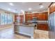 Spacious kitchen featuring custom wood cabinets, granite countertops, and stainless steel appliances at 4894 E Palm Beach Dr, Chandler, AZ 85249