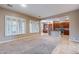 Open living room with large windows and seamless flow into a modern kitchen, perfect for entertaining at 4894 E Palm Beach Dr, Chandler, AZ 85249