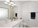 Bright bathroom featuring white cabinets, white countertop, and modern fixtures at 5350 E Deer Valley Dr # 2435, Phoenix, AZ 85054