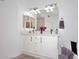Bright bathroom with a double sink vanity, granite countertop, and views into the shower and tub at 5350 E Deer Valley Dr # 2435, Phoenix, AZ 85054