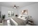 Cozy bedroom features natural light, neutral decor, and ceiling fan creating a serene atmosphere at 5350 E Deer Valley Dr # 2435, Phoenix, AZ 85054