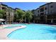 Resort-style community pool surrounded by lounge chairs and lush landscaping, perfect for relaxation at 5350 E Deer Valley Dr # 2435, Phoenix, AZ 85054